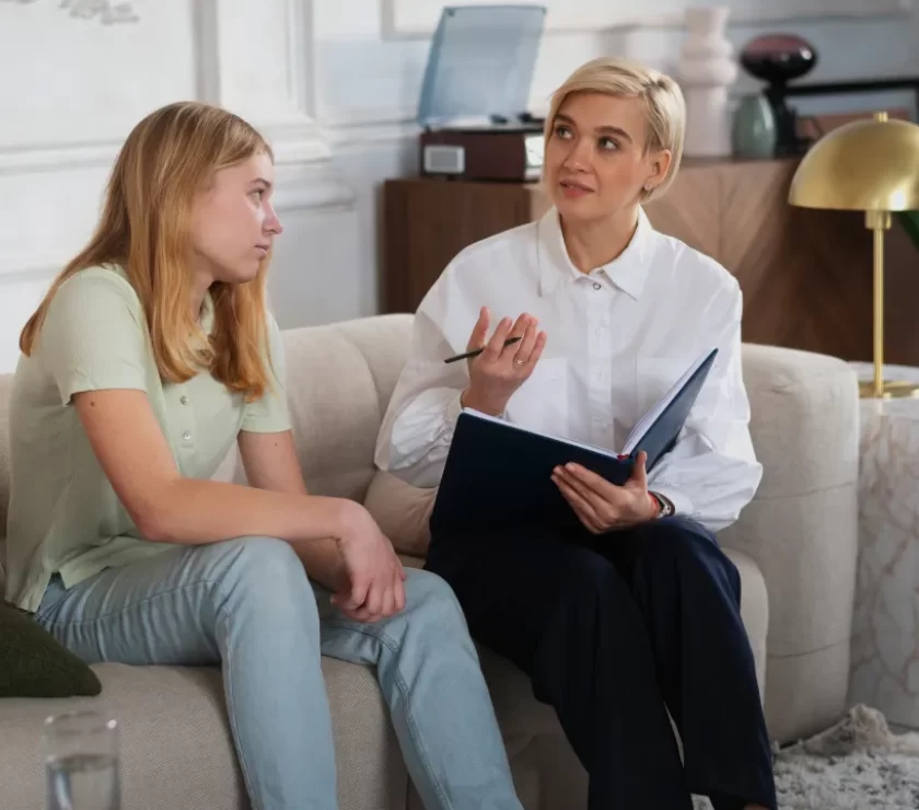 Teenage girl talking with a counsellor