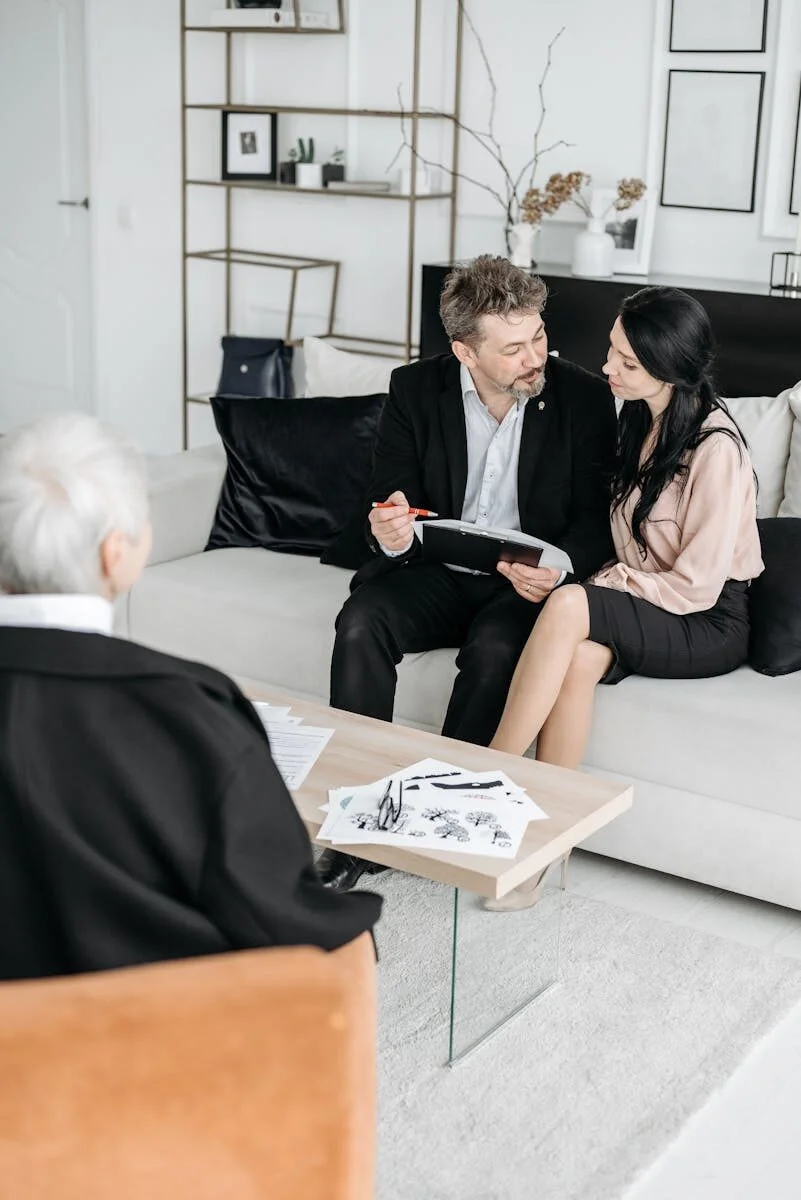 Therapist taking notes during a counselling session