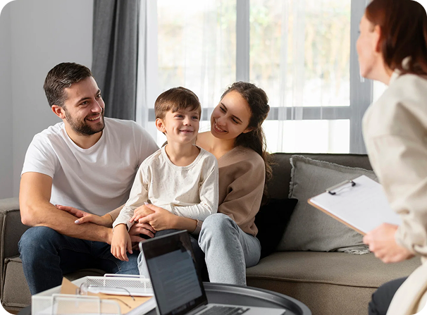 Family sitting together on a sofa at home